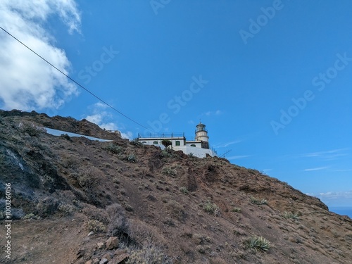 he Punta de Anaga Lighthouse in Tenerife, located on the island’s northernmost point, stands as a symbol of maritime navigation, surrounded by stunning coastal landscapes photo