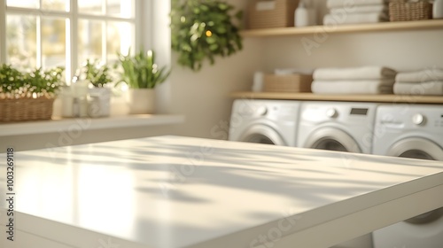 White table top with sunlight shadow in front of a washing machine in a white laundry room.