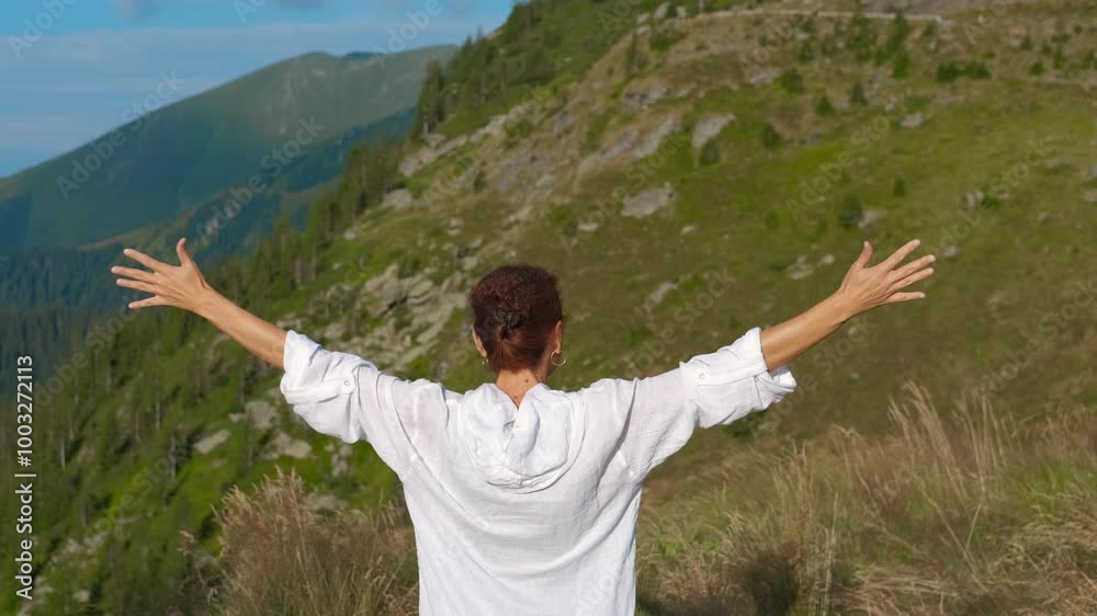 Woman admire Transylvania hills. A view of cute female traveler admire the nature of green mountains during transylvani trip. Woman admire Transylvania hills. A view of cute female traveler admire the nature of green mountains during transylvani trip.