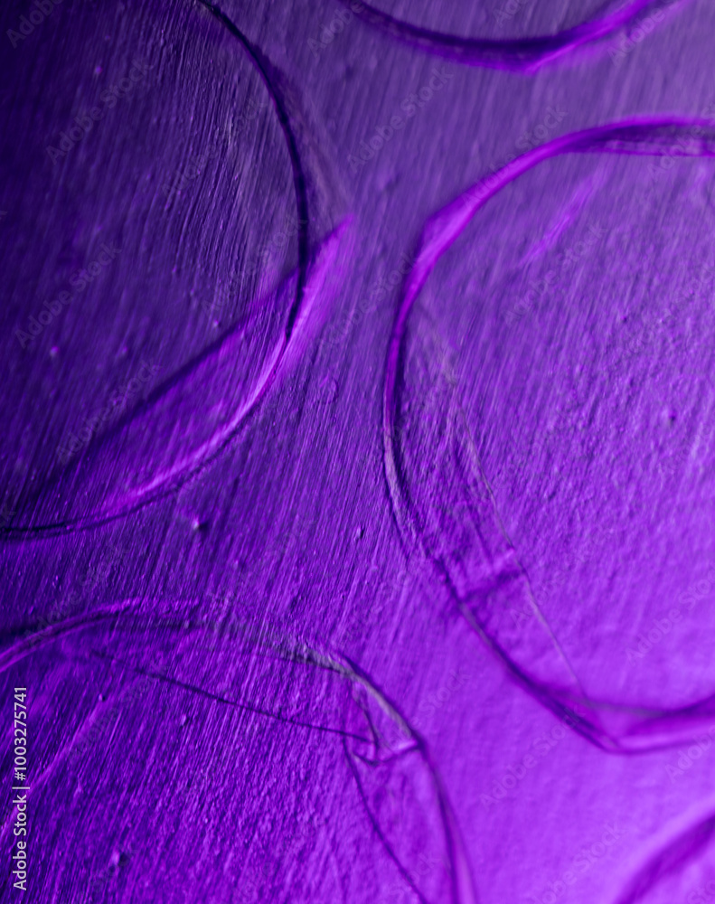 Fototapeta premium A purple background with overlapping purple circles. The circles are of varying sizes and are positioned in different areas of the background. The overall effect is a visually striking