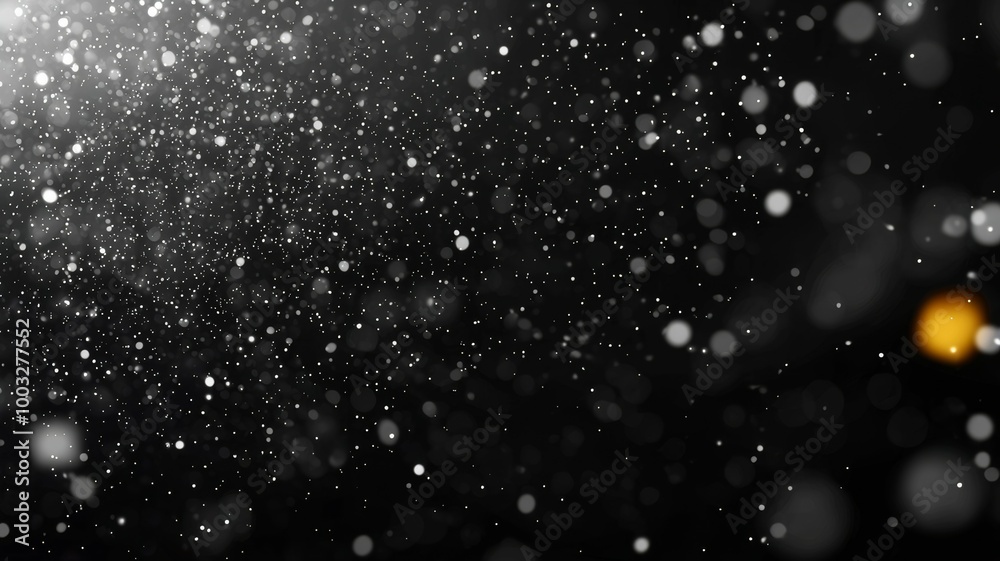 A black and white photo of snowflakes falling on a dark background A black and white photo of snowflakes falling on a dark background