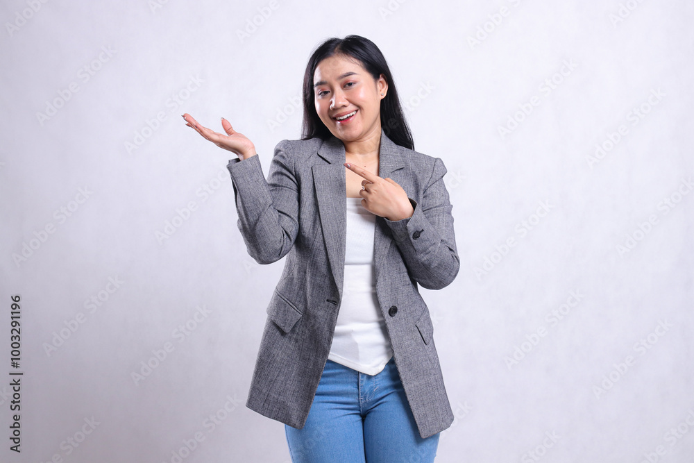 expression of beautiful young girl smiling cheerful hand pointing, presenting to the right wearing gray suit and jeans standing isolated on white background. for advertising content, fashion expression of beautiful young girl smiling cheerful hand pointing, presenting to the right wearing gray suit and jeans standing isolated on white background. for advertising content, fashion