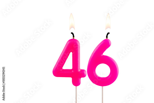 Pink number 46 birthday candle on white background