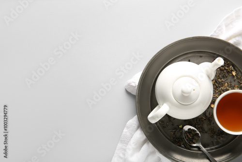 Tray with tea pot, cup and ...