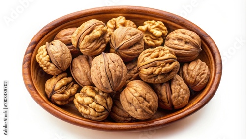 Walnuts in a baked clay dish seen from above isolated on white background, walnuts, clay dish, baked, from above, isolated, food