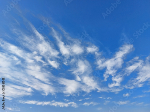 gentle white clouds in the blue sky