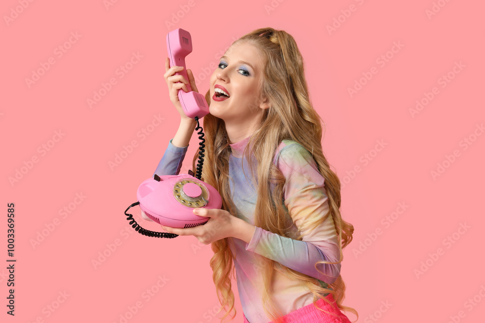 Beautiful young happy woman with retro telephone on pink background Beautiful young happy woman with retro telephone on pink background