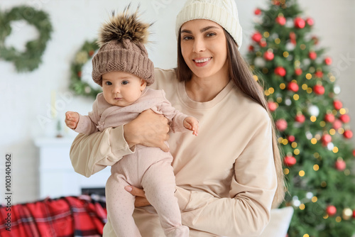 Happy young mother holding ...