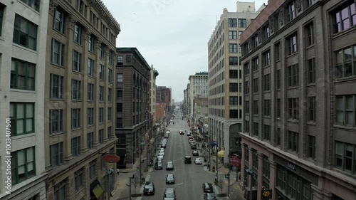 A vibrant view of the Washington Avenue Loft District, showcasing its historic architecture, trendy lofts, and lively atmosphere, capturing the essence of urban living and revitalization.