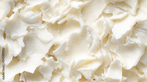 a close-up, top-down view of coconut butter spread across the frame, filling the image with its soft white color and smooth, creamy texture