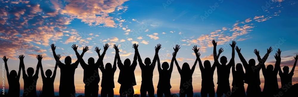 Silhouettes of People with Arms Raised Against a Sunset Sky Silhouettes of People with Arms Raised Against a Sunset Sky