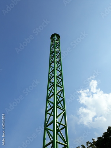 Green tower in the blue sky
