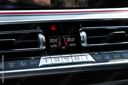 Black car interior: climat control view with air conditioning button inside a car photo