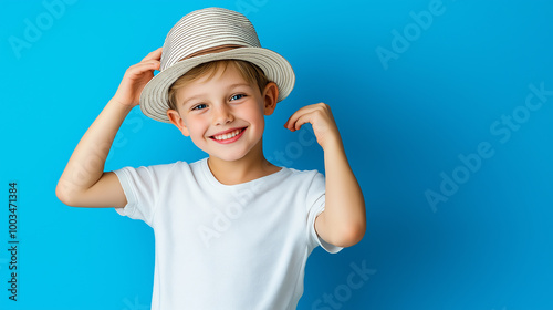 Cheerful boy wearing a hat smiling on a blue background