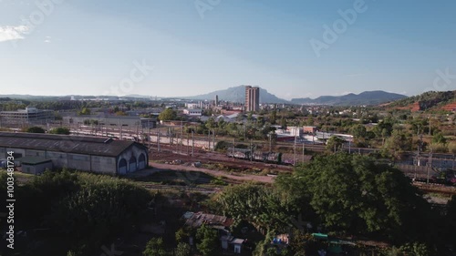 4k cinematic drone. Industrial area and Train station in Martorell, a city Catalonia, Spain, primarily known for its medieval Devil's bridge photo