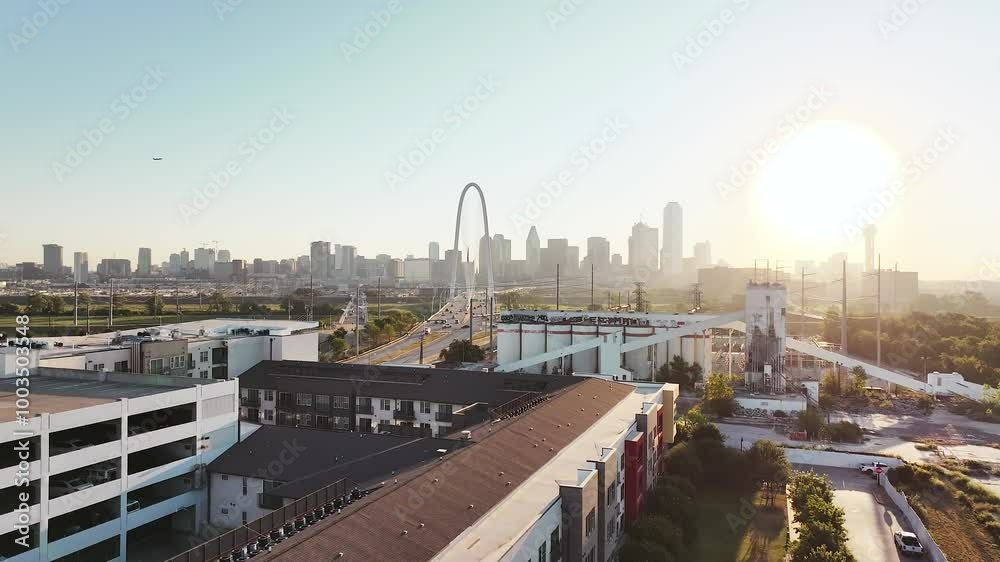 Aerial video of the Margaret Hunt Hill Bridge in downtown Dallas, Texas on a beautiful clear blue sky morning