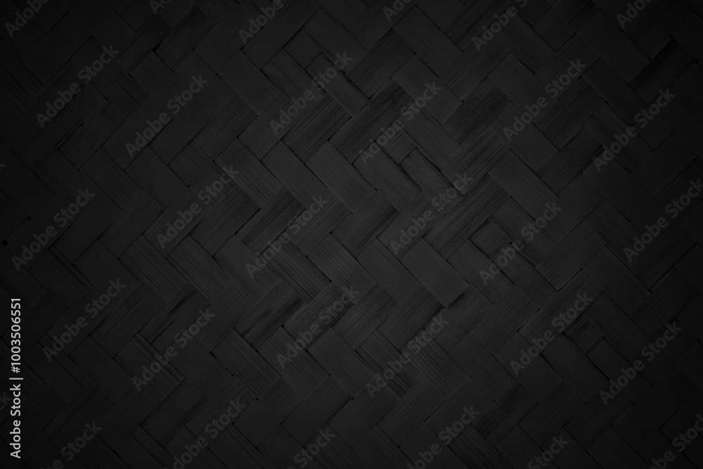 Black bamboo weaving pattern, old woven rattan mat texture for background and design art work.