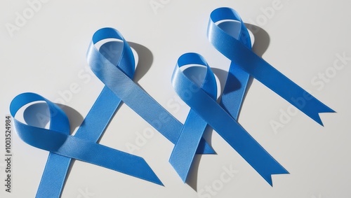 Blue ribbon awareness for Colon Cancer, Child Abuse, and World Diabetes Day on a white background