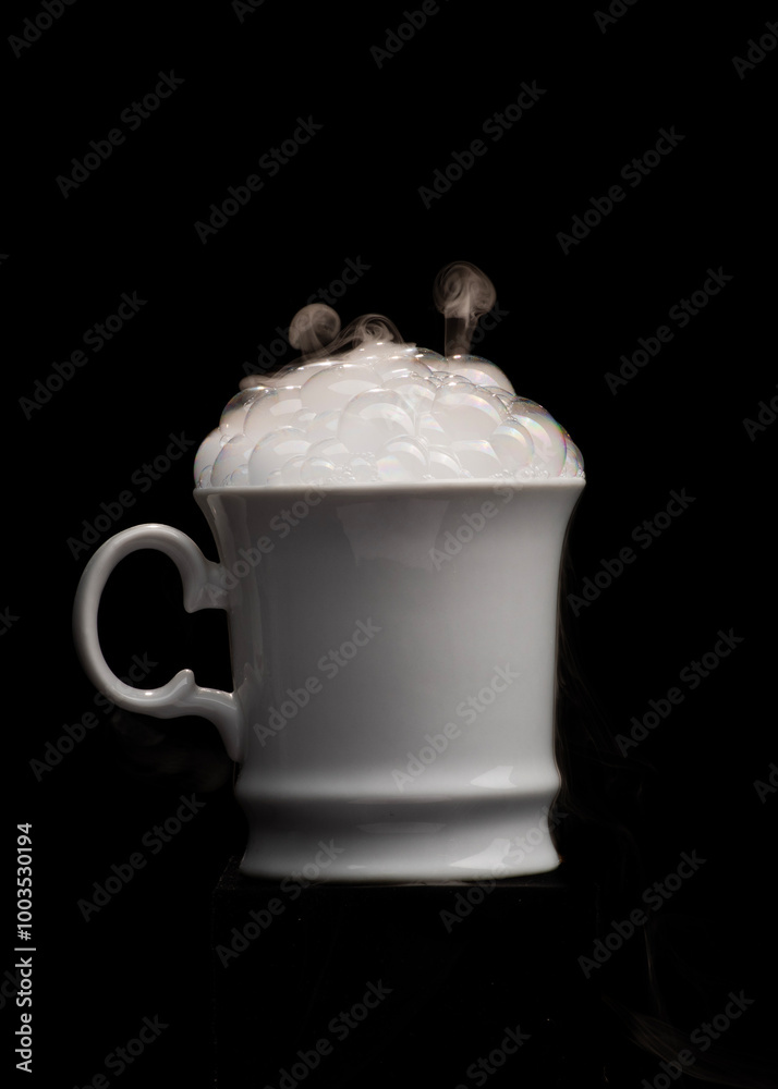 Coffee cup filled with strange swirling fog and vapour creating unique patterns and shape rising and falling from cup Coffee cup filled with strange swirling fog and vapour creating unique patterns and shape rising and falling from cup