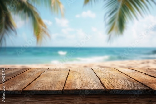 Fototapeta Naklejka Na Ścianę i Meble -  A wooden table top with a blurred background of a beach with blue water and palm trees.