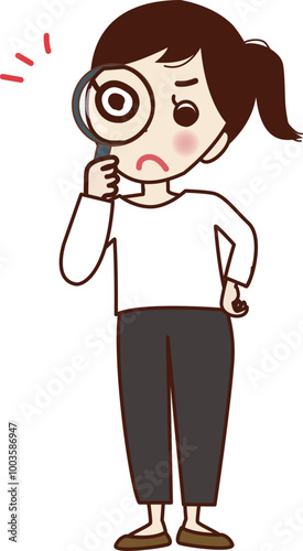 虫眼鏡で見る若い女性。