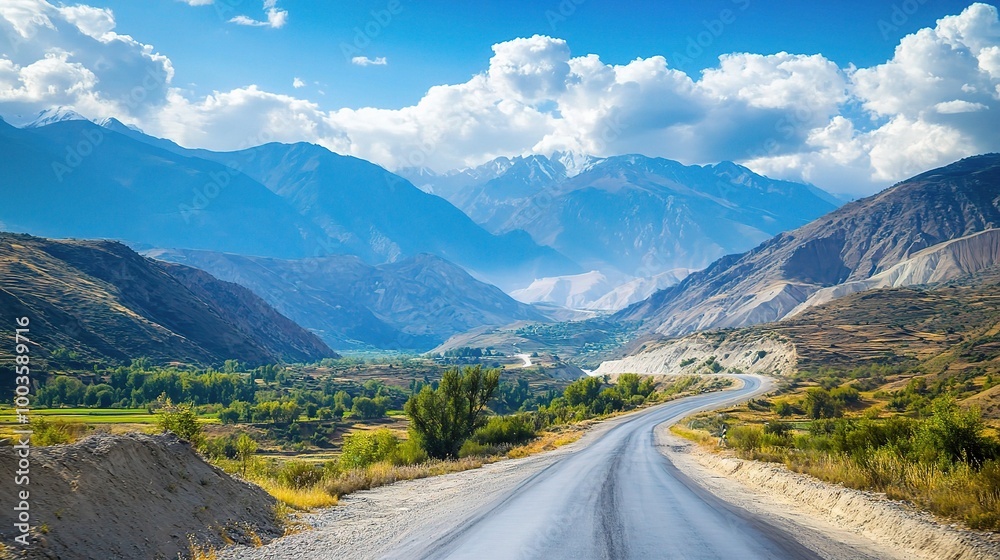 Scenic Mountain Road with Lush Greenery and Blue Sky Scenic Mountain Road with Lush Greenery and Blue Sky