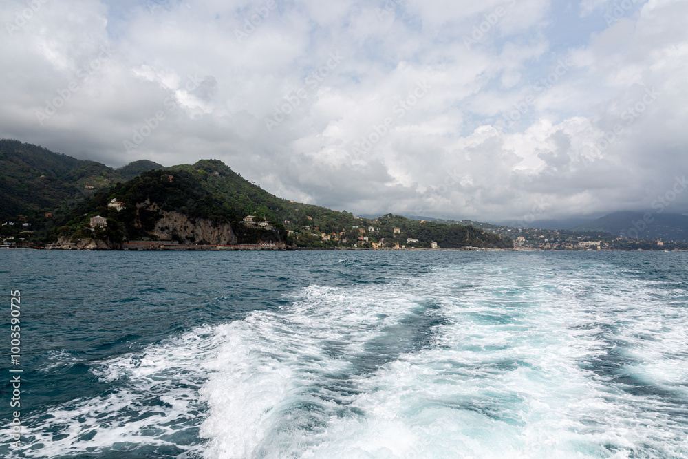 View to the shore near Portofino from the sea with dramatic sky View to the shore near Portofino from the sea with dramatic sky