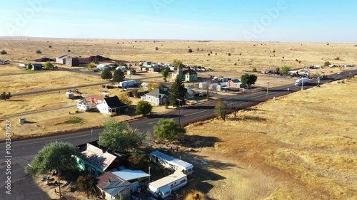 4k Aerial drone video footage of the abandoned, famous ghost town Shaniko in Central Oregon in a desert area. Captured during fall season.  photo