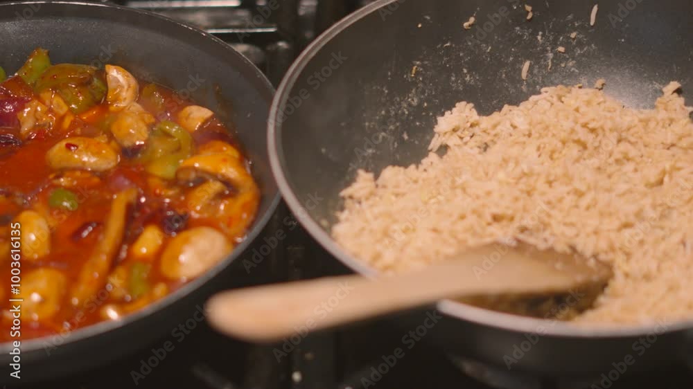 Overview of Delicious Oriental Asian Egg Fried Rice Cooking in Wok and Sweet and Sour Chicken Dish with Vegetables in Frying Pan. Steam Rising in Slow Motion 4K Overview of Delicious Oriental Asian Egg Fried Rice Cooking in Wok and Sweet and Sour Chicken Dish with Vegetables in Frying Pan. Steam Rising in Slow Motion 4K