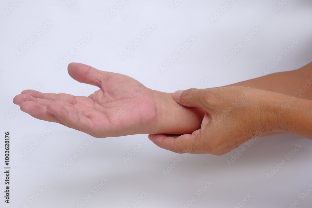 A pair of hands checking the pulse of the blood pressure A pair of hands checking the pulse of the blood pressure
