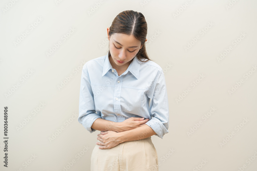 Flatulence asian young woman intolerance hand in stomach ache, suffer from food poisoning, abdominal pain and colon problem, gastritis or diarrhoea when at home. Patient belly, abdomen or inflammation Flatulence asian young woman intolerance hand in stomach ache, suffer from food poisoning, abdominal pain and colon problem, gastritis or diarrhoea when at home. Patient belly, abdomen or inflammation
