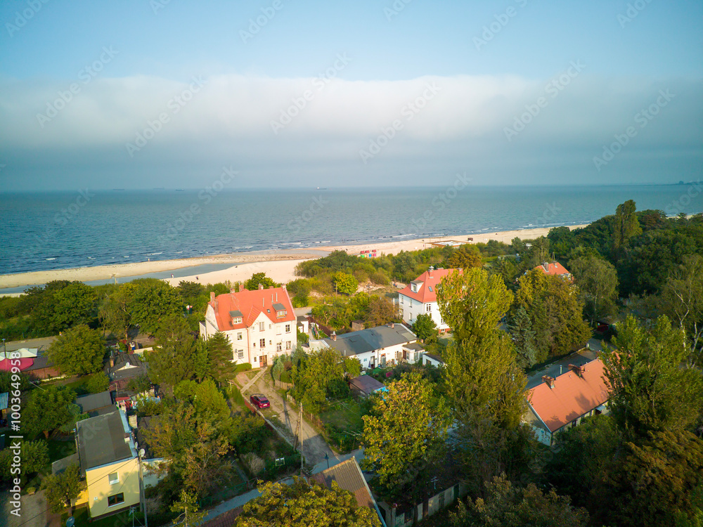 Seaside town of Jelitkowo, buildings with beach and sea.