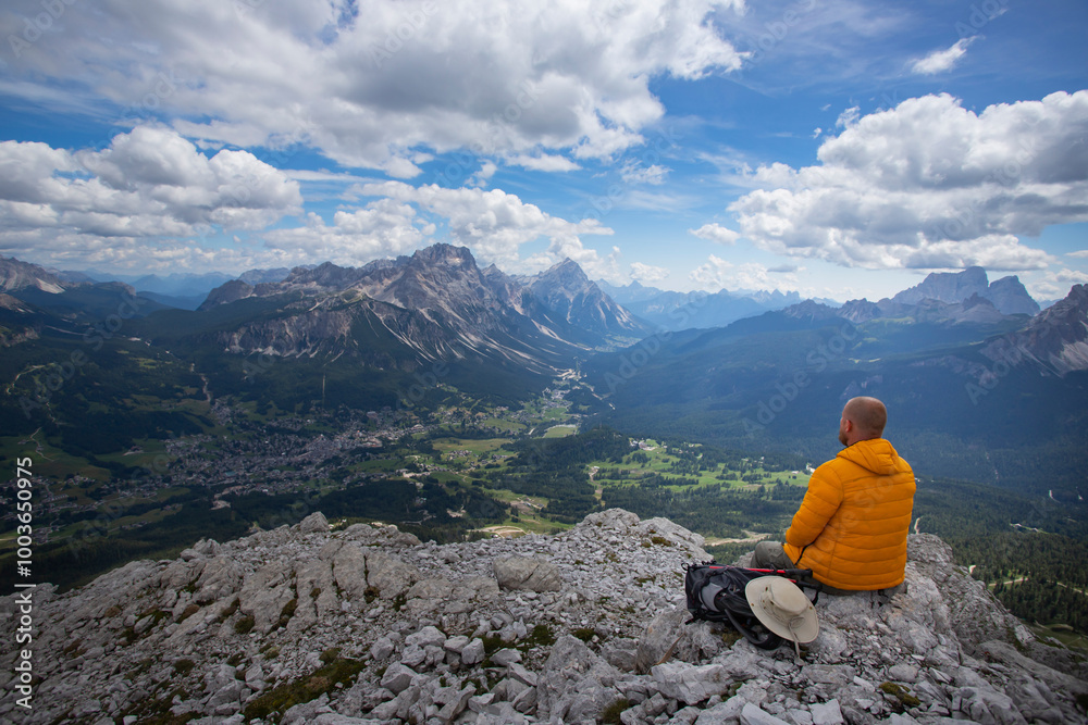 Hiker enjoys the view from Tofana di Mezzo, in the italian Dolomites. Hiker enjoys the view from Tofana di Mezzo, in the italian Dolomites.