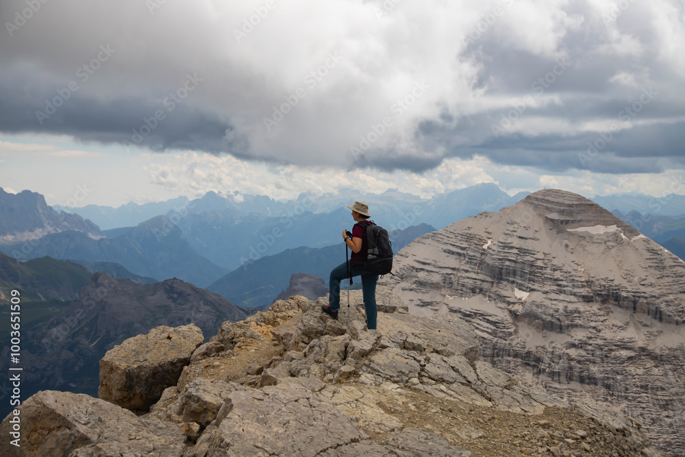Hiker enjoys the view from Tofana di Mezzo in the italian Dolomites.