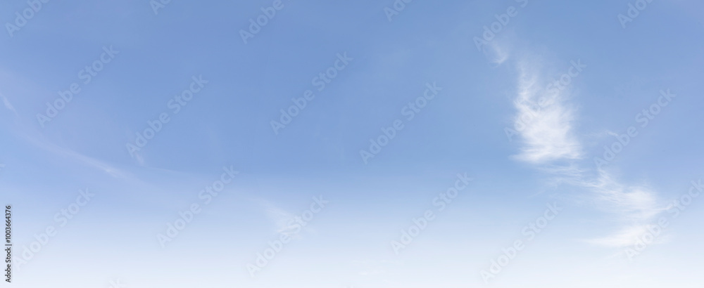 The clear blue sky with white clouds provides a bright and sunny background, enhancing the natural beauty of the landscape on this pleasant summer day The clear blue sky with white clouds provides a bright and sunny background, enhancing the natural beauty of the landscape on this pleasant summer day
