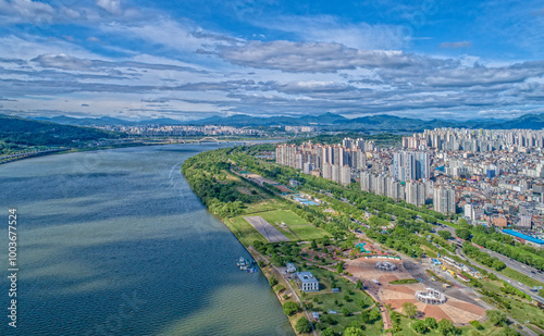 Amsa-dong, Gangdong-gu, Seoul, South Korea - May 19, 2020: Aerial view of the Amsa Dunchi Ecological Park and highrise apartments near Han River  photo