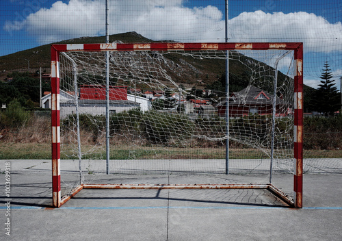 Football goal with destroyed net at an abandoned soccer pitchon the Coast of Death in Larino, Galicia, Spain