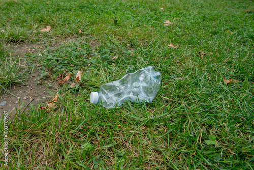 plastic waste in a meadow, plastic pollution is reaching intolerable levels, too many pollutants dispersed in the earth, seas and oceans. recycling and respect for nature. photo