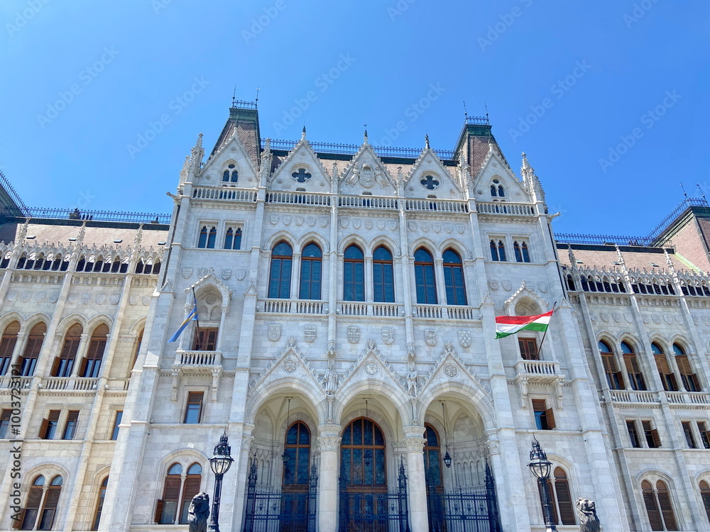 Fototapeta premium The impressive medieval architectural beauty of the ensemble of buildings of the Hungarian Parliament will not leave any viewer indifferent.