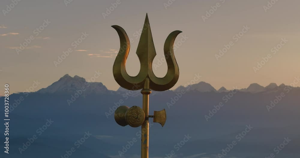 Drone shot of Lord Shiva's Trishul in Nepal during sunrise sunrays illuminate trident on a hillside of Shailung Dolakha near Tibet powerful scene of mountain ranges horizon with holy Kailash Parbat