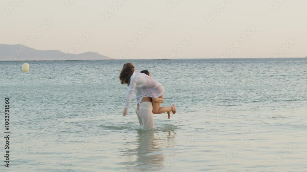 Romantic lesbian couple enjoying a playful moment at the beach