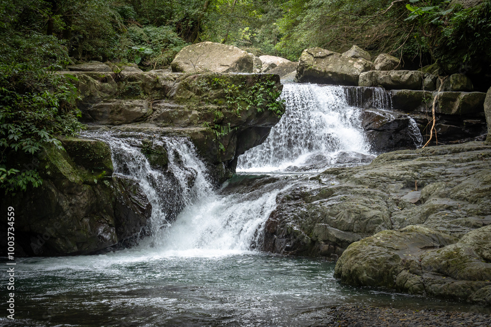 River goes like stair from the beautiful shape rocks, hidden in the forest, in Manyueyuan Forest Recreation Area, New Taipei City, Taiwan. River goes like stair from the beautiful shape rocks, hidden in the forest, in Manyueyuan Forest Recreation Area, New Taipei City, Taiwan.