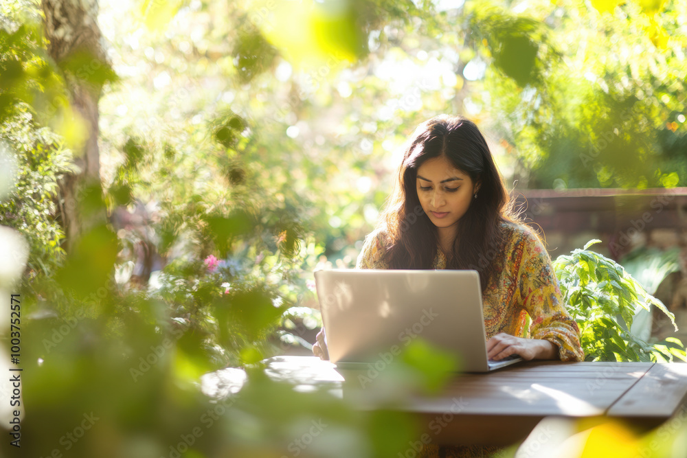 Woman Working on Laptop Outdoors in Lush Garden, Woman working on her laptop outside in a bright, green garden setting, surrounded by nature and sunlight.
Woman Working on Laptop Outdoors in Lush Garden, Woman working on her laptop outside in a bright, green garden setting, surrounded by nature and sunlight.