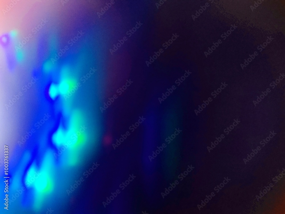 Blue bokeh light effect against a dark background. The speed of light creates beautiful compositions.