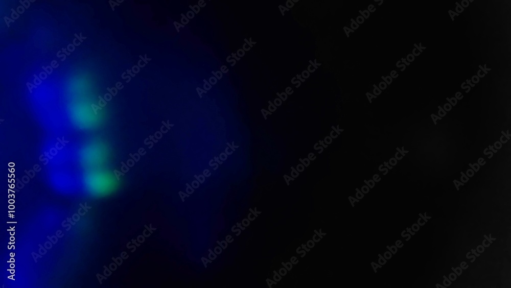 Blue bokeh light effect against a dark background. The speed of light creates beautiful compositions. Blue bokeh light effect against a dark background. The speed of light creates beautiful compositions.