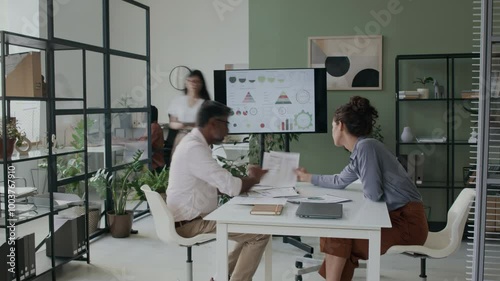 Time lapse of diverse colleagues meeting at office to discuss tasks