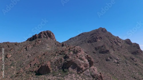 Aerial Odyssey: Scorching Arizona Desert Landscape, Majestic Saguaros, and Endless Rocky Terrain Unveiled in Stunning Drone Footage Under Blazing Desert Skies. photo