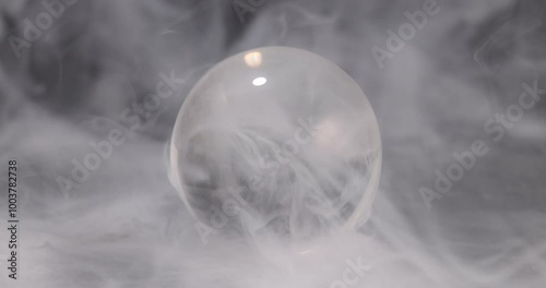 Smoke mist fog vapour crystal glass ball on black background