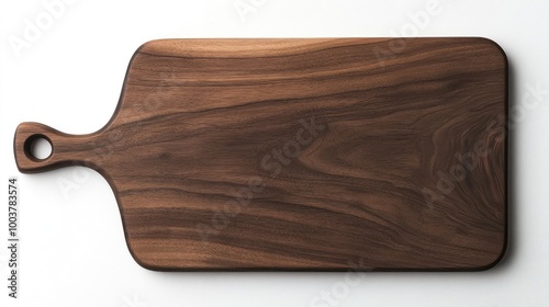 A large wooden cutting board with a handle, made from rich walnut wood, isolated on a white background. photo