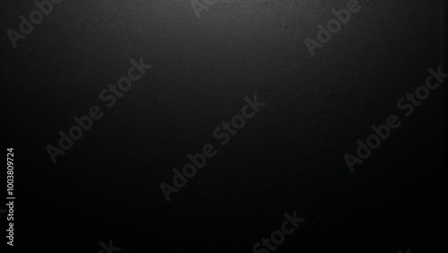 Solid black background texture for versatile design applications and creative projects